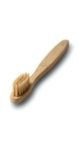 Natural bamboo toothbrush with soft bristles isolated on white background for eco-friendly dental care and sustainable oral hygiene routine.