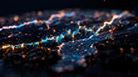 Abstract dark surface with glowing blue and orange light particles creating magical bokeh effect for technology backgrounds and digital art projects.