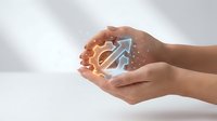 Cupped hands holding glowing upward arrow with sparkles symbolizing growth, success, and opportunity in business and personal development.