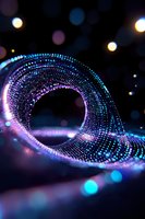 Glowing spiral of luminous particles in blue and purple colors creating dynamic wave pattern against dark background with bokeh light effects.