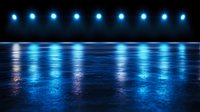Blue stage lights reflecting on dark glossy surface create dramatic atmosphere with parallel light beams and water-like reflections on empty performance space floor.