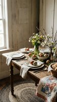Rustic Easter table setting with eggs, spring flowers and natural decor in farmhouse dining room with wooden furniture and vintage textiles.