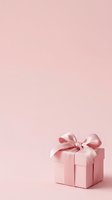Pastel pink gift box with satin ribbon bow on soft pink background, isolated and ready for holiday, celebration, and promotional design projects.