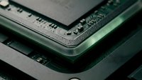 Computer circuit board components stacked in layers showing microchip technology, electronics manufacturing, and hardware engineering for tech industry use.
