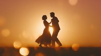 Romantic couple dancing together at golden sunset with warm bokeh lights creating dreamy atmosphere for wedding invitations and love concepts.