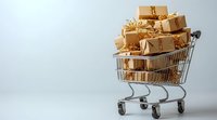 Shopping cart filled with golden wrapped gift boxes and presents on light background, holiday shopping and retail concept for special occasions.