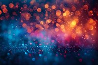 Abstract bokeh background with glowing orange, red and blue defocused lights creating magical atmospheric effect for festive or celebration designs.
