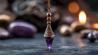 Elegant copper wire wrapped amethyst crystal pendulum with purple gemstone point surrounded by healing stones and warm candlelight for spiritual practices.