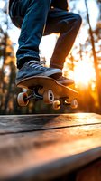 Skateboarder performing trick at sunset, close-up of sneakers and board against golden sunlight through trees, creating dramatic silhouette and atmosphere.