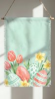 Watercolor Easter banner with pink tulips, daffodils and decorated eggs on mint green fabric with rope hanger for spring holiday home decor.