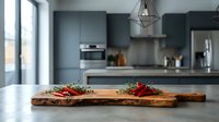 Fresh ingredients on wooden cutting board in modern kitchen interior with gray cabinets and stainless steel appliances for culinary preparation and cooking.