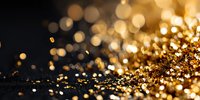 Luxurious gold glitter particles scattered on dark background creating festive bokeh effect, suitable for luxury product advertising.