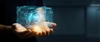 Person holding glowing digital cube with circuit patterns and holographic technology interface for innovation, data science, and futuristic business solutions.