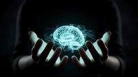 Glowing brain hologram floating above open hands against dark background representing artificial intelligence, neuroscience and mental health concepts.