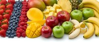 Fresh colorful fruits collection including strawberries blueberries raspberries mango pineapple apples bananas oranges arranged on white background.