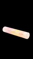 Translucent cylindrical tube filled with pink and yellow gradient cosmetic product, isolated on transparent background ready for clipart, t-shirt design, stickers, print-on-demand and sublimation projects.
