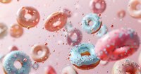 Flying colorful glazed donuts with sprinkles on pink background, sweet dessert food levitation concept with dynamic motion and splashing sugar particles.