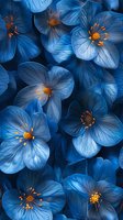 Luminous blue flowers with delicate petals and golden stamens create dramatic macro composition against dark background. Artistic floral photography for wall decor.