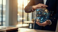 Businessman in suit holding glowing digital globe with network connections in modern office environment representing global business technology and connectivity.
