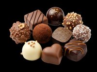 Assorted chocolate truffles and bonbons isolated on transparent background, ready for confectionery packaging, recipe blogs, bakery menus, print-on-demand products, and culinary design projects.