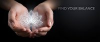 Hands holding glowing lotus flower outline on dark background with find your balance text for wellness and mindfulness concepts.
