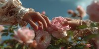 Young woman hand gently touching blooming pink rose in garden with soft sunlight creating dreamy romantic atmosphere for wellness and nature concepts.