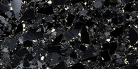 Black granite texture with silver and gold speckles on polished stone surface creates luxurious natural pattern for interior design and architecture projects.