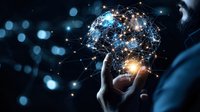 Glowing network sphere with connected dots and lines floating above hand against dark background with bokeh lights represents digital transformation.