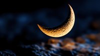 Golden crescent moon floating above rocky terrain with dramatic blue night sky background creating mystical celestial atmosphere for astronomy and space themes.