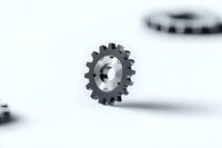 Metallic gear wheel floating on white background with soft shadow, industrial mechanical part isolated for engineering and technology concepts.