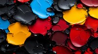 Vibrant oil paint palette with mixed colors including red, blue, yellow and black creating artistic texture for creative projects and design work.