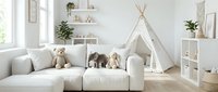 Modern bright children's playroom with white teepee tent, cozy sofa, stuffed animals and floating shelves creating safe space for kids activities and imagination.