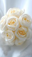 Delicate cream white roses in bridal bouquet arrangement against soft light background, featuring pure ivory petals with subtle yellow undertones. For wedding design.