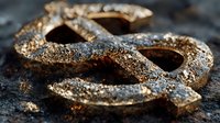 Rusty weathered metal chain links with corrosion and oxidation texture lying on rough concrete surface for industrial and decay concepts.