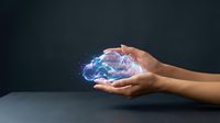 Young adult with medium skin tone holding glowing digital brain hologram, representing artificial intelligence, technology innovation, and futuristic computing concepts for business applications.