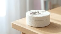 White soft cheese wheel with lavender sprig on wooden cutting board in bright kitchen setting for gourmet cooking and artisan dairy products.