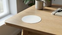 Modern wooden desk with built-in wireless charging pad for smartphones and devices in minimalist home office workspace setup.