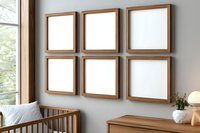 Six square wooden frames arranged in grid on gray wall above wooden furniture, bright natural lighting through window creates modern gallery wall display.
