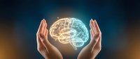 Hands cradling glowing brain with warm and cool light halves, representing innovation, creativity, and artificial intelligence technology for business and science concepts.