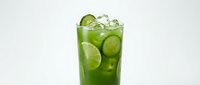 Refreshing green cucumber lime iced drink in a tall glass with ice cubes, isolated on white background for menu and food design use.