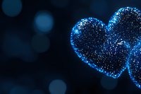 Glowing blue heart shape made of sparkles and glitter particles on dark background with bokeh lights, romantic Valentine's day concept.
