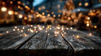 Empty wooden table surface with warm bokeh lights creating cozy atmosphere for product display and seasonal marketing campaigns.