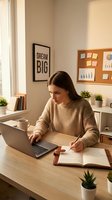 Young woman with long brown hair, Caucasian ethnicity, wearing a beige ribbed sweater, working at a wooden desk with laptop and notebook in a bright, organized home office with motivational wall art.