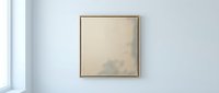 Minimalist square canvas artwork with thin gold frame hanging on clean white wall near bright window in modern interior space for home decor and gallery display.