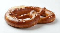 Freshly baked soft pretzels with coarse salt crystals on white background, ready for bakery, food service, or culinary design projects.
