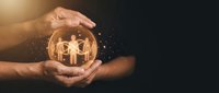 Two hands holding glowing crystal sphere containing silhouettes of people, symbolizing protection, teamwork, unity, community care, insurance, family security and business partnership concepts.