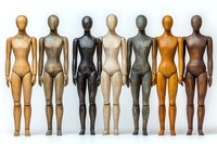 Diverse wooden mannequins in different skin tones standing in row showing inclusivity and representation, artistic display on white background.