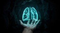 Glowing turquoise lungs floating above open palm in dark atmospheric setting for medical healthcare respiratory system concept presentations.