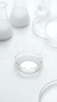 Laboratory water splash in petri dish with scientific glassware on white surface, suitable for research, biotechnology, and medical science backgrounds.