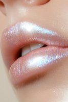 Close-up of lips with iridescent holographic gloss makeup showing pearly shine and sparkle effect, beauty cosmetics detail for fashion and glamour industry.